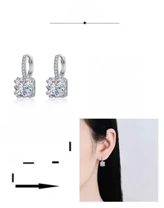 Detail of square moissanite earrings with rhodium plating and four-prong setting