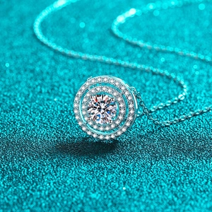 Exquisite S925 sterling silver necklace with double-circle moissanite pendant on green background