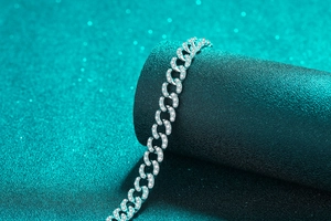 Detail of S925 sterling silver Cuban link bracelet with full moissanite stones