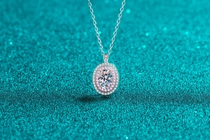 Macro view of S925 silver necklace with oval moissanite pendant and pink halo