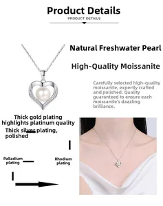 Macro detail of silver heart pendant with freshwater pearl and moissanite accents
