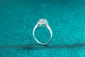 Close-up of radiant cut moissanite ring with double pink and white diamond halo