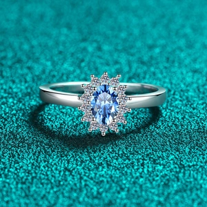 S925 sterling silver ring featuring an oval blue moissanite in a sparkling halo setting