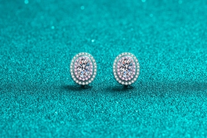 Macro shot of oval moissanite studs with double pink and white halo in 925 silver