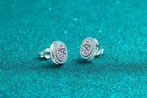Macro shot of 925 sterling silver oval moissanite stud earring with double halo detail