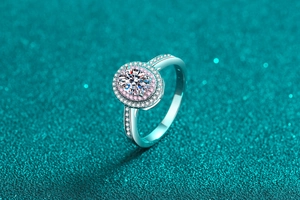 Macro shot of 925 silver ring featuring a round moissanite with double pink halo