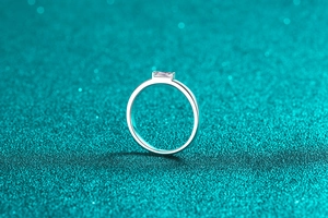 Macro side view of S925 sterling silver ring featuring a rectangular emerald-cut moissanite stone