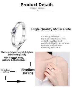 Emerald cut moissanite ring on model hand showing refined silver plating and polish