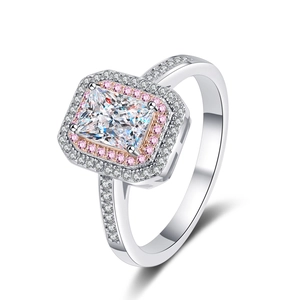 925 silver ring featuring rectangular emerald cut moissanite with pink halo design