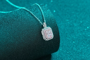 Close-up of S925 silver necklace with emerald cut moissanite and pink halo stones