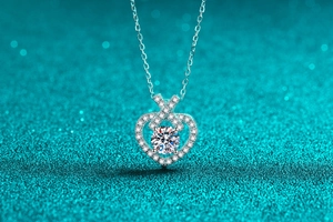 Macro detail of S925 silver heart necklace with sparkling Moissanite floating stone
