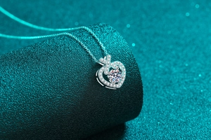 Macro shot of S925 sterling silver heart pendant with shimmering moissanite gemstone