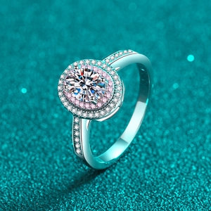 Oval moissanite ring with double halo of pink and white diamonds in silver band