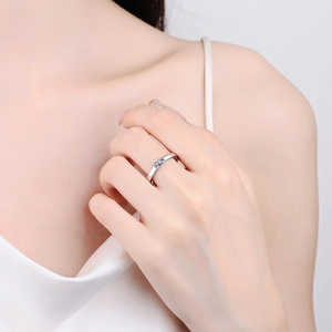 Minimalist S925 silver ring with emerald-cut blue moissanite shown on model's finger