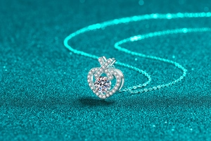 Close-up of S925 silver heart necklace with a floating round brilliant-cut moissanite stone