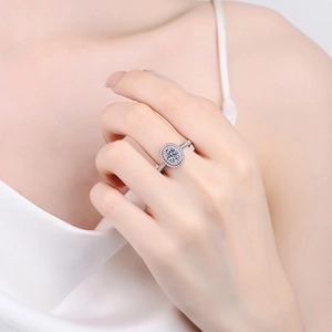 925 silver halo ring with oval pink moissanite stone worn on hand for display