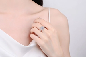 Macro shot of S925 silver ring featuring a blue square stone and pink pavé crystals