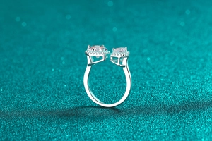 Macro shot of S925 silver open ring featuring two halo-set round moissanite stones