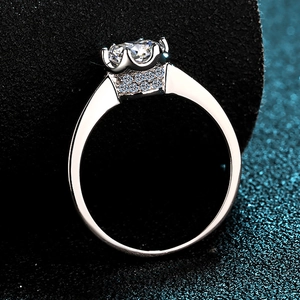 Elegant S925 sterling silver moissanite ring with six-prong crown setting and side diamonds
