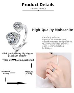 Detail of S925 silver open ring with double hearts and sparkling moissanite stones