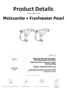 Detail view of 925 silver U-shape earrings with 6mm freshwater pearl and 0.06ct moissanite