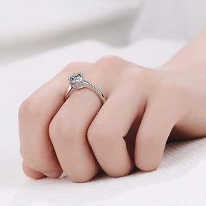Elegant S925 sterling silver six-prong crown ring featuring a brilliant round moissanite stone