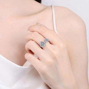Elegant S925 sterling silver open ring featuring double heart-shaped moissanite stones