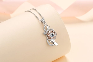 Macro detail of S925 silver rose necklace with moissanite inlay and two-tone plating