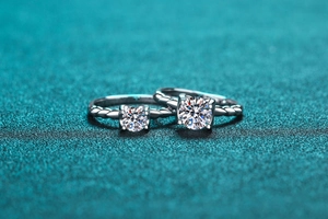 Macro detail of S925 silver moissanite rings with twisted band and round cut stone