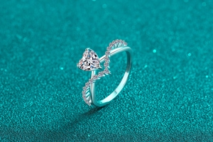 Macro detail of S925 sterling silver ring featuring a heart-cut stone and wave accents