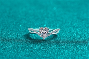 Macro detail of S925 silver heart cut moissanite ring with twisted pavé band