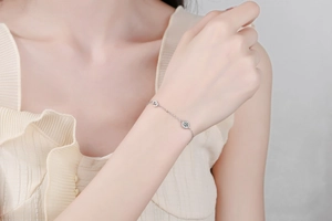 Close-up of S925 sterling silver moissanite bracelet worn on model wrist for lifestyle