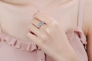 Macro view of S925 sterling silver moissanite ring with elegant leaf detail on band