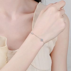 S925 sterling silver bracelet featuring sparkling round moissanite and pave circle charms