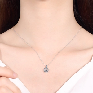 S925 sterling silver necklace with a sparkling moissanite pendant worn on model neck