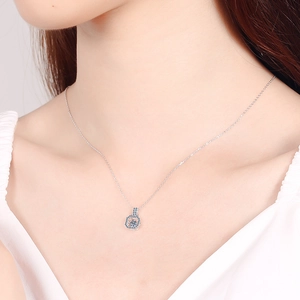 Elegant S925 sterling silver necklace with blue gemstone pendant shown on a model