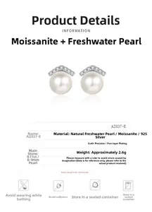 Detail view of S925 silver earrings with freshwater pearl and moissanite stones