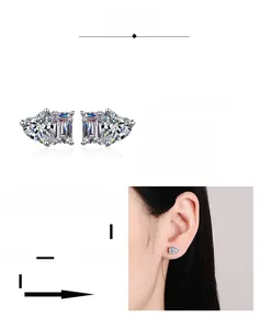 Detail of heart and rectangular cut moissanite earrings with multi-layer gold plating