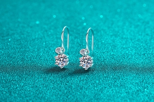Macro shot of S925 sterling silver drop earrings with brilliant round moissanite stones