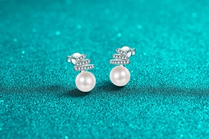 Macro view of Christmas tree earrings with S925 silver moissanite and white pearls