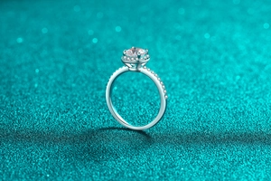 Side view detail of S925 sterling silver ring with 1ct moissanite in halo setting