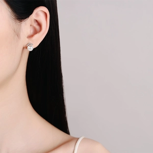 Elegant S925 sterling silver pearl earrings with V-shaped pavé accents on model