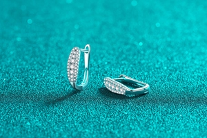 Macro view of S925 sterling silver hoop earrings with micro-pave moissanite stones