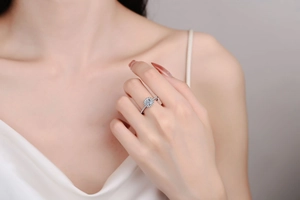 Elegant S925 sterling silver halo ring with a 1ct moissanite stone on a model's hand