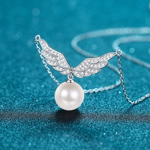 S925 silver necklace with pearl pendant and pavé angel wings on teal frosted background