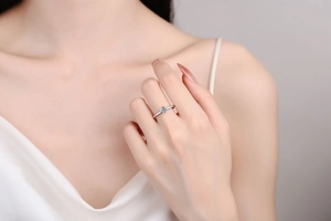Macro shot of minimalist S925 sterling silver ring with a round moissanite stone