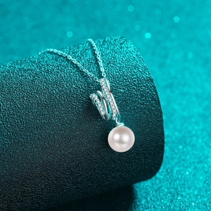 S925 silver moissanite pearl pendant necklace on sea-green textured pedestal