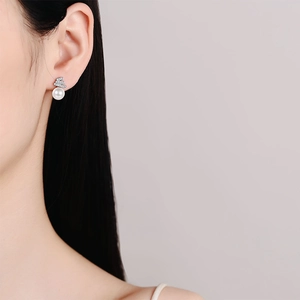 Elegant S925 sterling silver freshwater pearl earrings with moissanite stones on model