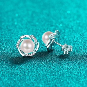 Elegant S925 sterling silver pearl stud earrings with moissanite accents in a floral bud design