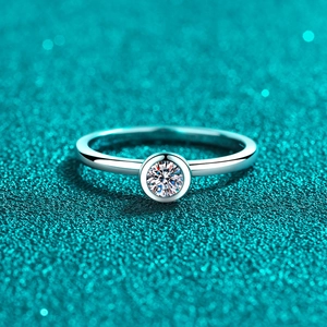 Minimalist S925 sterling silver ring featuring a round bezel-set moissanite stone